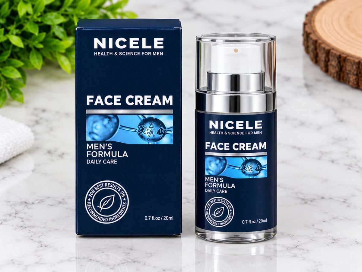 Nicole Face Cream for men's daily care, shown with its navy blue box and clear pump bottle on a white marble surface with green leaves in the background.
