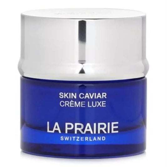 La Prairie Skin Caviar Crème Luxe cream jar with a deep blue glass container and a reflective silver metallic lid, on a white background.